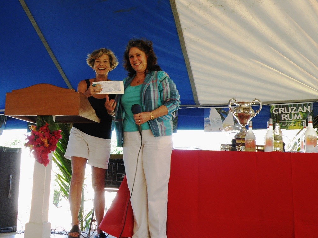 Julie San Martin and Tracy Sanders accept the first contribution to Hospice - St. Croix Yacht Club Hospice Regatta © Ellen Sanpere